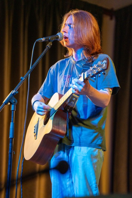 Vocalist singing into microphone